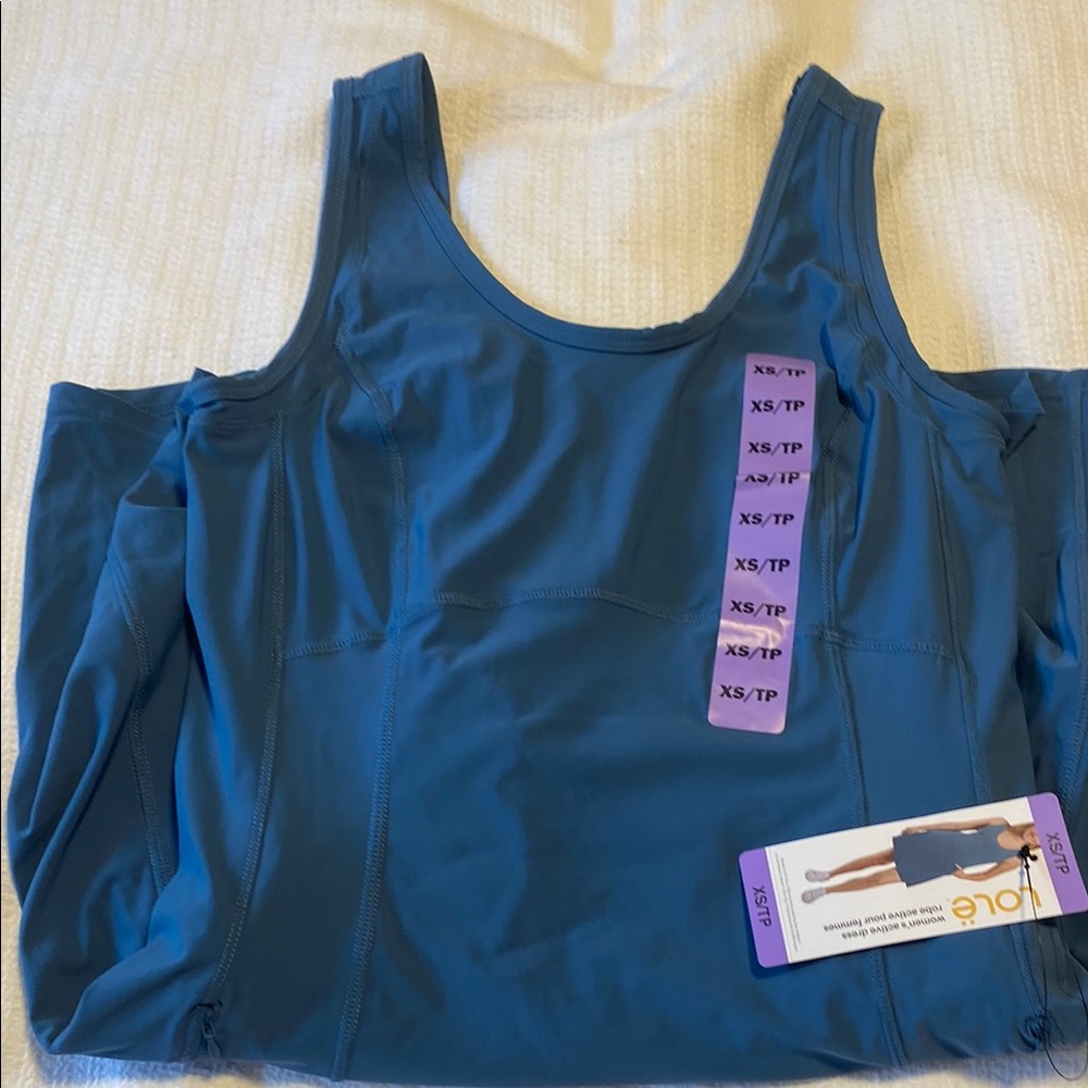 Lole Blue one piece tennis dress with built in shorts and pockets.